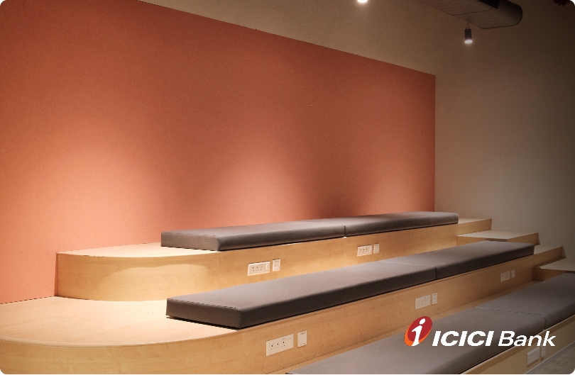 Acoustic wall panelling and tiered seating at ICICI Bank, by UniVicoustic