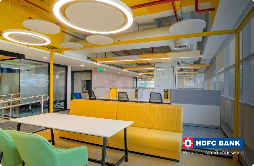Circular acoustic ceiling clouds at an HDFC Bank office, by UniVicoustic