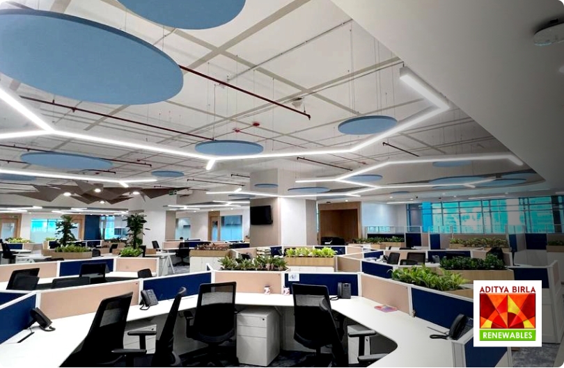 Acoustic ceiling discs and baffles at an Aditya Birla Renewables office, by UniVicoustic